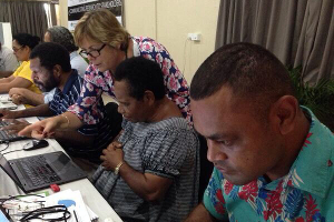 Cathy Reade helps participants get connected to Twitter