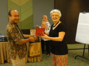 Margaret Cargill making a presentation to a participant at conclusion of the workshop