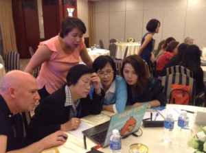 Participants reviewing case materials which include digitised fish histology slides